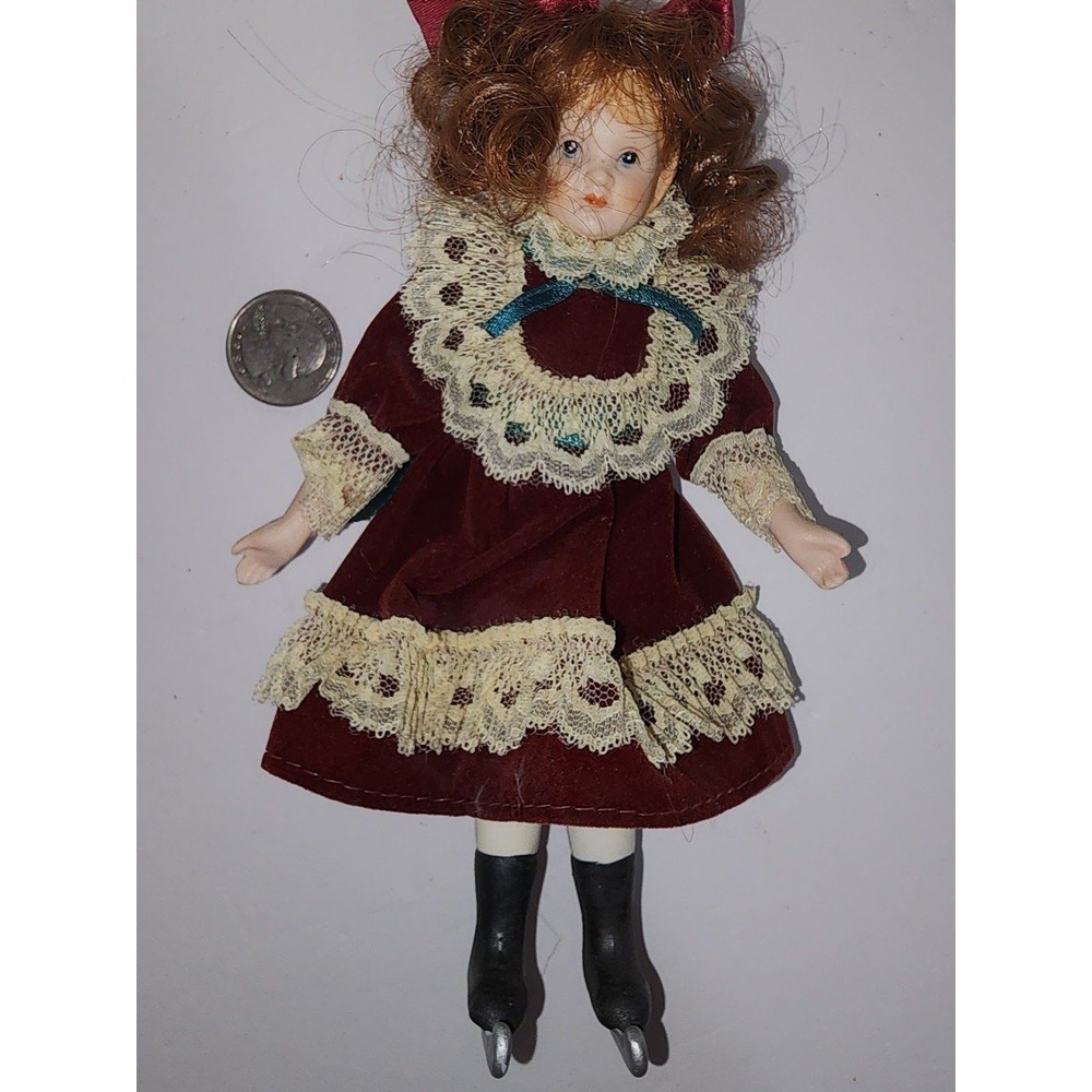 Vintage China Doll in Red Velvet and ice skates‎